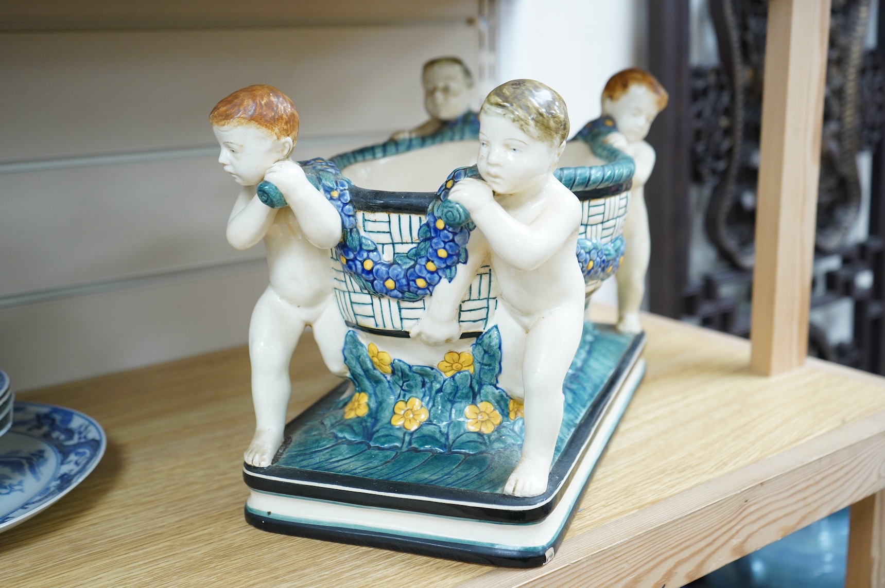A Karlsruhe jardiniere with four putti designed by Wilhelm Süs in 1908, model number 1002, 33cm wide